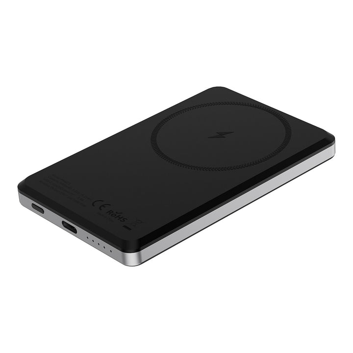Zwarte TUNIQ powerbank liggend met ronde laadmarkering en zichtbare aansluitingen